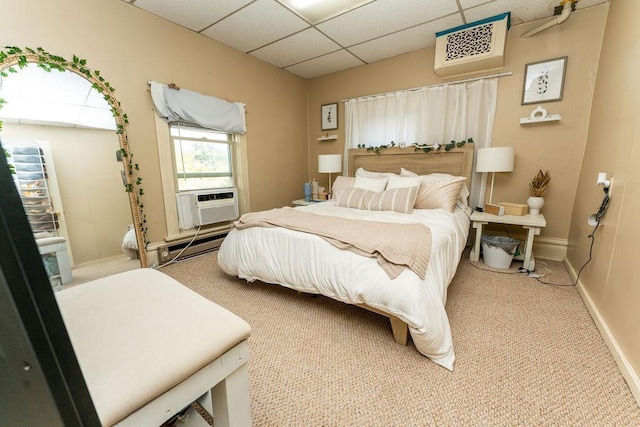 306 Wisconsin St, Oshkosh, WI 54901 - bedroom featuring carpet floors, a drop ceiling, baseboards, baseboard heating, and cooling unit