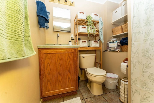 306 Wisconsin St, Oshkosh, WI 54901 - bathroom with toilet, tile patterned flooring, and vanity