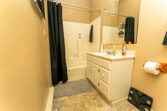 306 Wisconsin St, Oshkosh, WI 54901 - full bathroom featuring shower / bathtub combination with curtain, vanity, and stone finish floors