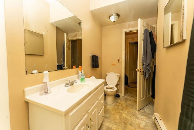 306 Wisconsin St, Oshkosh, WI 54901 - bathroom with toilet, vanity, and baseboard heating