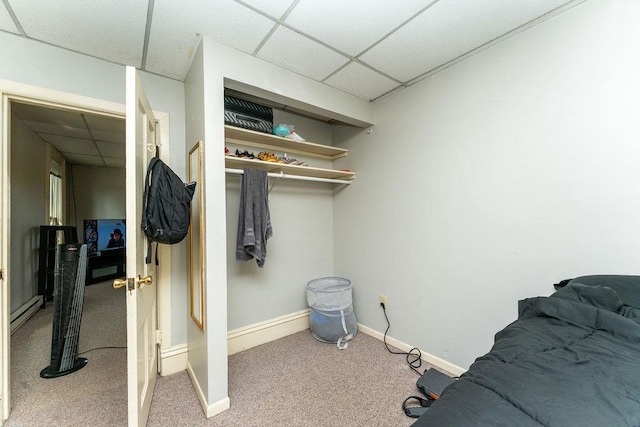 306 Wisconsin St, Oshkosh, WI 54901 - carpeted bedroom with a drop ceiling, baseboards, and baseboard heating