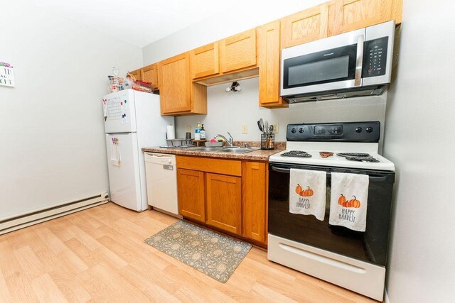 306 Wisconsin St, Oshkosh, WI 54901 - kitchen featuring white appliances, a sink, light wood-type flooring, and baseboard heating