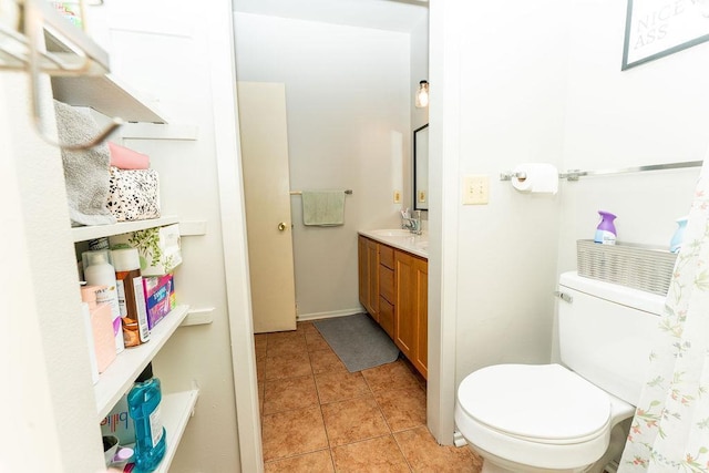 306 Wisconsin St, Oshkosh, WI 54901 - bathroom featuring toilet, vanity, and tile patterned flooring