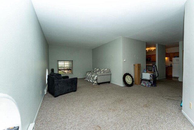 306 Wisconsin St, Oshkosh, WI 54901 - sitting room featuring carpet and baseboards