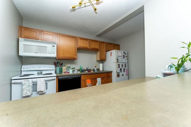 306 Wisconsin St, Oshkosh, WI 54901 - kitchen featuring white appliances, a sink, and light countertops