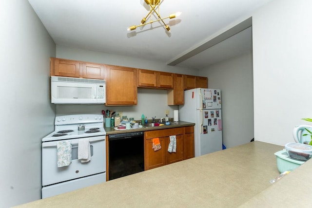 306 Wisconsin St, Oshkosh, WI 54901 - kitchen featuring white appliances, a chandelier, a sink, brown cabinets, and light countertops