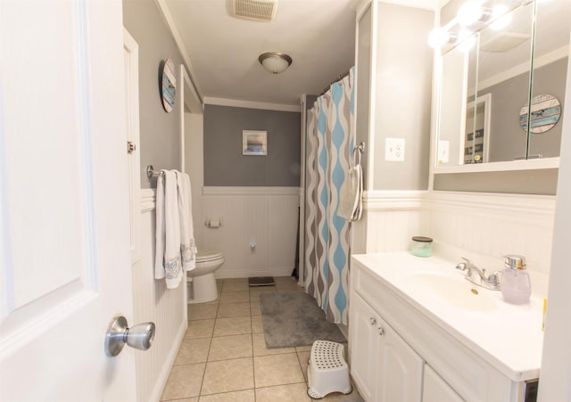 514 Doty St, Mineral Point, WI 53565 - bathroom with a wainscoted wall, toilet, tile patterned flooring, vanity, and crown molding