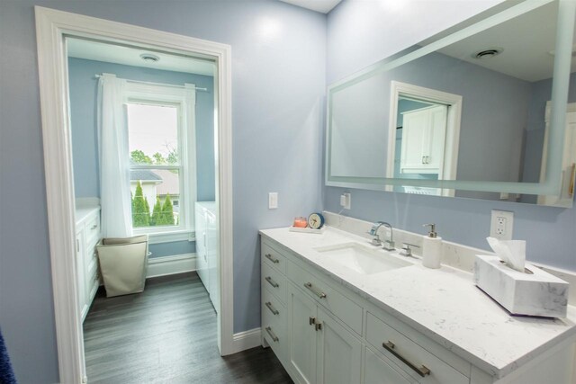 514 Doty St, Mineral Point, WI 53565 - bathroom with vanity, wood finished floors, and baseboards