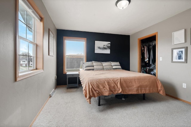 2731 Hamilton St, Oshkosh, WI 54901 - carpeted bedroom with baseboards, a walk in closet, and a closet
