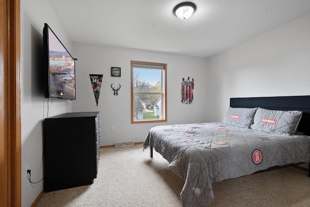 2731 Hamilton St, Oshkosh, WI 54901 - bedroom featuring light colored carpet and baseboards