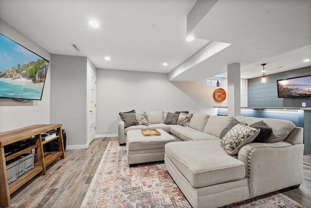 2731 Hamilton St, Oshkosh, WI 54901 - living area with wood finished floors, baseboards, and recessed lighting