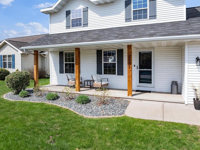 2731 Hamilton St, Oshkosh, WI 54901 - view of front of home with a porch, roof with shingles, and a front lawn