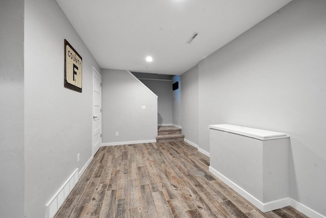2731 Hamilton St, Oshkosh, WI 54901 - hallway featuring wood finished floors, stairs, baseboards, and recessed lighting