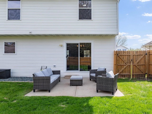 2731 Hamilton St, Oshkosh, WI 54901 - back of house featuring an outdoor hangout area, a patio area, and a gate