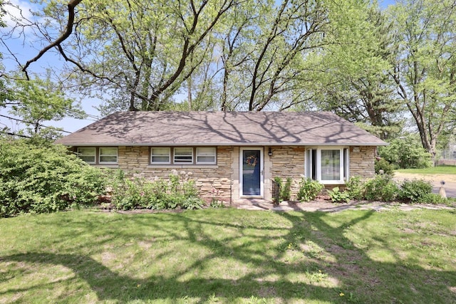 W209N7020 Fillmore Dr, Menomonee Falls, WI 53051 - view of front of home featuring stone siding and a front lawn