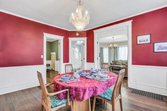 822 12th Ave, Union Grove, WI 53182 - dining space with a chandelier, wainscoting, wood-type flooring, and crown molding