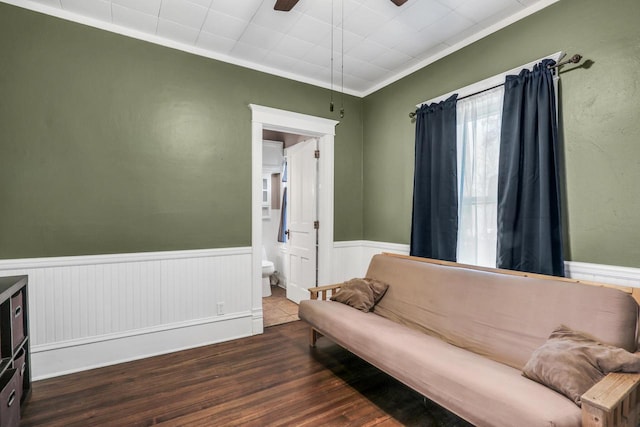 822 12th Ave, Union Grove, WI 53182 - sitting room featuring wood finished floors, a wainscoted wall, a ceiling fan, and ornamental molding