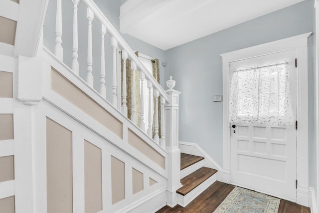 822 12th Ave, Union Grove, WI 53182 - entryway with dark wood-type flooring, stairs, and baseboards