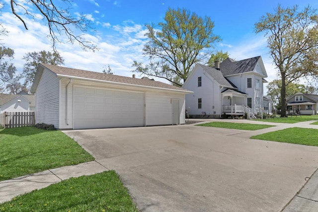 822 12th Ave, Union Grove, WI 53182 - view of front facade featuring a garage and an outdoor structure