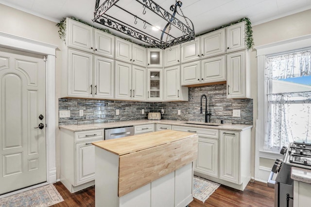822 12th Ave, Union Grove, WI 53182 - kitchen featuring a sink, butcher block counters, dark wood-type flooring, and white cabinetry