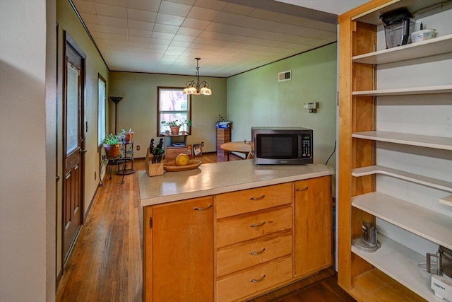 1614 Lake View Ave, Madison, WI 53704 - kitchen with dark wood-style floors, open shelves, light countertops, and brown cabinetry