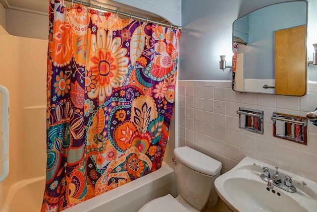 1614 Lake View Ave, Madison, WI 53704 - full bath with a sink, tile walls, toilet, and shower / tub combo with curtain