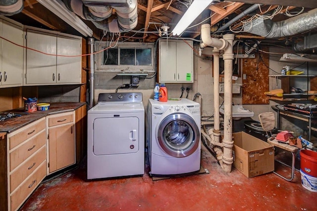 1614 Lake View Ave, Madison, WI 53704 - washroom featuring washing machine and clothes dryer and cabinet space