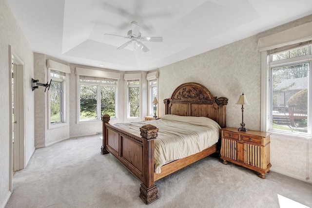 2531 Huntington Way, Suamico, WI 54173 - bedroom featuring light colored carpet, baseboards, a raised ceiling, a wall mounted AC, and ceiling fan