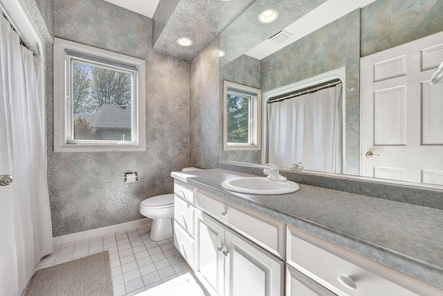 2531 Huntington Way, Suamico, WI 54173 - full bathroom featuring tile patterned flooring, baseboards, toilet, and vanity