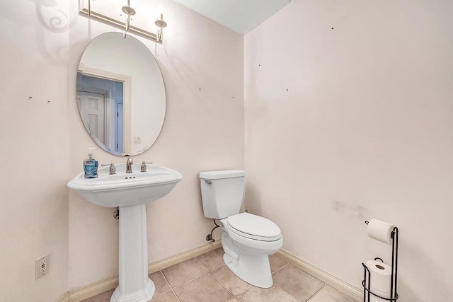 2531 Huntington Way, Suamico, WI 54173 - half bath featuring toilet, tile patterned floors, baseboards, and a sink