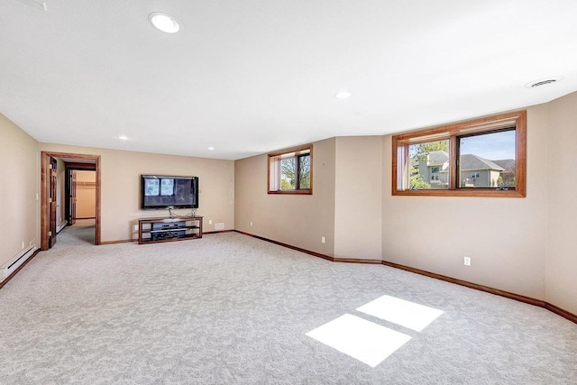 2531 Huntington Way, Suamico, WI 54173 - unfurnished living room featuring carpet, baseboards, recessed lighting, and a baseboard radiator