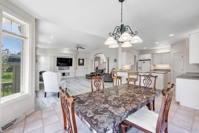 2531 Huntington Way, Suamico, WI 54173 - dining area with arched walkways, plenty of natural light, a chandelier, ceiling fan, and recessed lighting