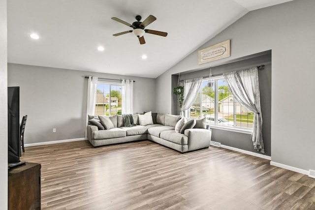 632 Grove St, Portage, WI 53901 - living area featuring a ceiling fan, wood finished floors, vaulted ceiling, recessed lighting, and baseboards