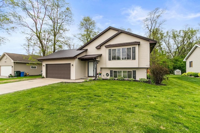 632 Grove St, Portage, WI 53901 - tri-level home featuring a garage, driveway, and a front lawn