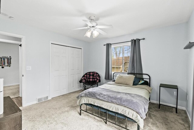 632 Grove St, Portage, WI 53901 - carpeted bedroom featuring a closet, baseboards, and ceiling fan
