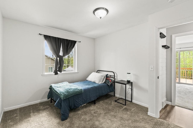 632 Grove St, Portage, WI 53901 - bedroom featuring carpet floors, baseboards, and access to exterior