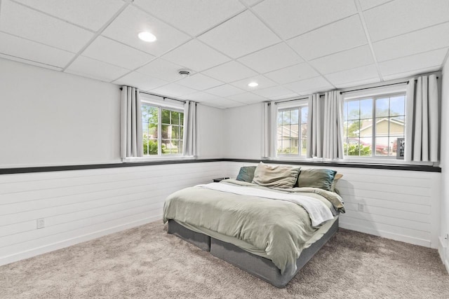 632 Grove St, Portage, WI 53901 - bedroom with carpet, wainscoting, recessed lighting, a paneled ceiling, and wood walls