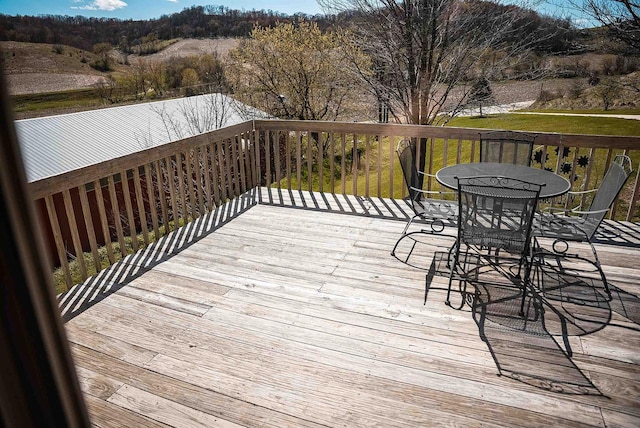 33902 County Rd N Unit L4, Hillpoint, WI 53937 - wooden terrace with outdoor dining space