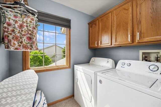 226 N Main St Unit 6, Walworth, WI 53184 - laundry room featuring cabinet space, washer and dryer, baseboards, and light colored carpet