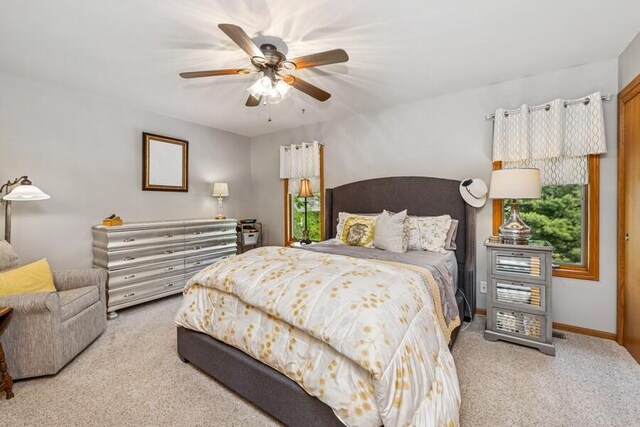 226 N Main St Unit 6, Walworth, WI 53184 - carpeted bedroom with ceiling fan and baseboards