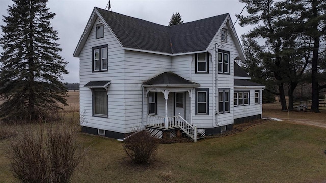 N2145 Lind Center Rd, Waupaca, WI 54981 - view of front facade featuring roof with shingles and a front lawn
