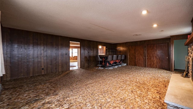 N2145 Lind Center Rd, Waupaca, WI 54981 - unfurnished living room featuring wooden walls and a textured ceiling