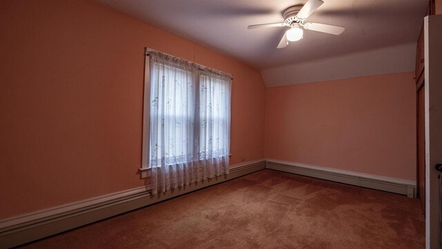 N2145 Lind Center Rd, Waupaca, WI 54981 - carpeted empty room with vaulted ceiling, a ceiling fan, baseboard heating, and baseboards