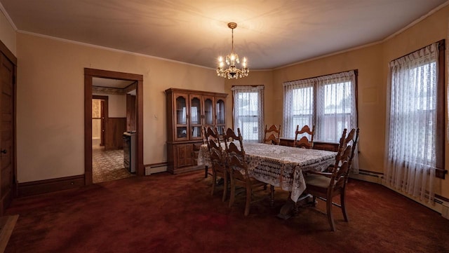 N2145 Lind Center Rd, Waupaca, WI 54981 - dining room featuring a baseboard heating unit, dark carpet, a chandelier, crown molding, and baseboards