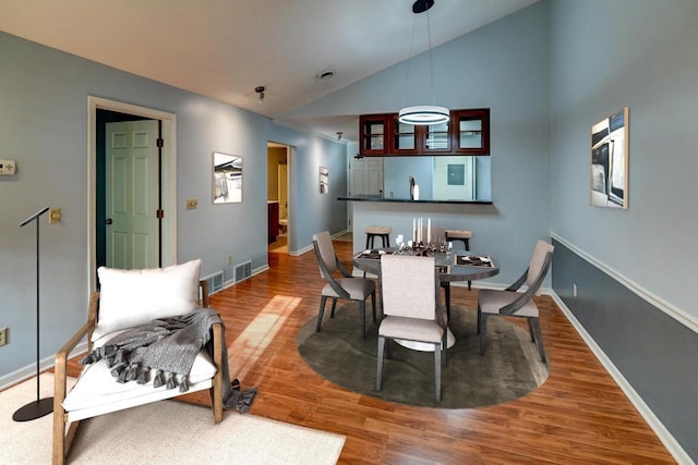 7102 Flagship Dr Unit 8, Madison, WI 53719 - dining area with lofted ceiling, wood finished floors, and baseboards
