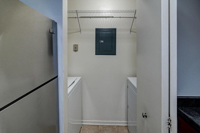 7102 Flagship Dr Unit 8, Madison, WI 53719 - washroom featuring independent washer and dryer, electric panel, tile patterned floors, and baseboards