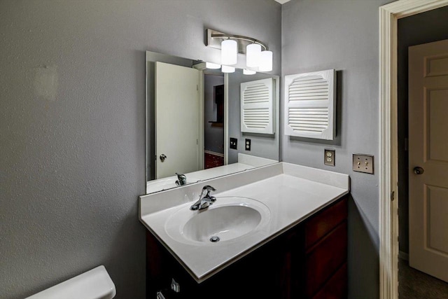 7102 Flagship Dr Unit 8, Madison, WI 53719 - bathroom featuring toilet and vanity