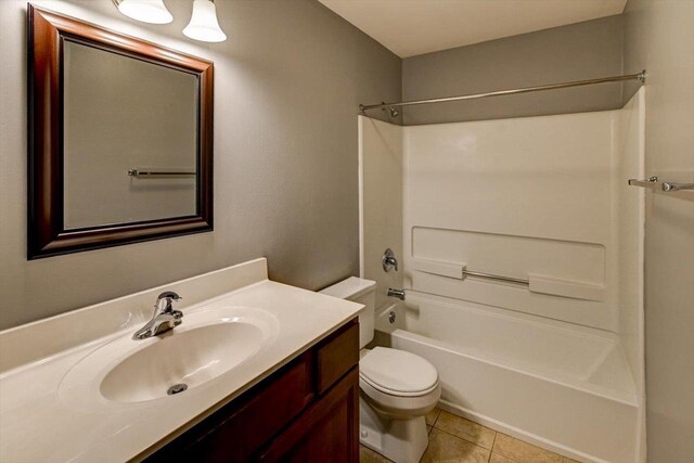 7102 Flagship Dr Unit 8, Madison, WI 53719 - full bathroom featuring toilet, tile patterned floors, vanity, and shower / bathtub combination