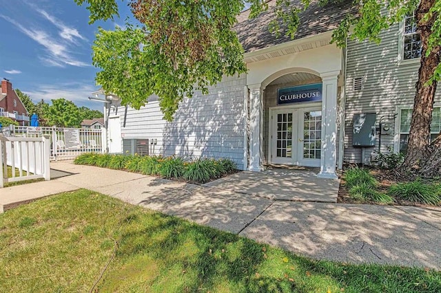 7102 Flagship Dr Unit 8, Madison, WI 53719 - doorway to property with french doors, fence, and roof with shingles