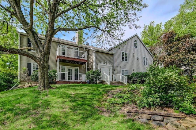 7102 Flagship Dr Unit 8, Madison, WI 53719 - back of house featuring a lawn, a deck, and a chimney